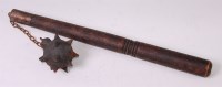 Lot 355 - A WW I trench club, having a spiked end, chain...