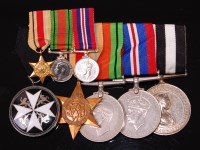 Lot 330 - A group of five medals to include The Order of...