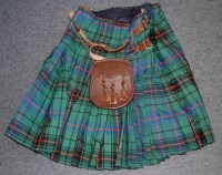 Lot 538 - A post WW II tartan kilt with leather straps...
