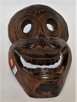 Lot 123 - A *** NEPALESE***carved softwood tribal mask