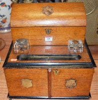 Lot 124 - A late Victorian oak and ebonised stationery...