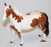 Lot 162 - A Beswick figure of a Pinto pony, second...