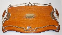 Lot 117 - A George V oak and silver plated twin handled...