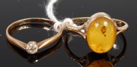 Lot 302 - A modern 9ct gold and amber set dress ring,...