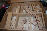 Lot 622 - A Meccano type child's wooden construction kit...
