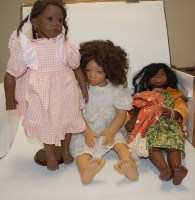 Lot 626 - A Karim Schmitz model doll, together with two...