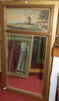 Lot 1088 - A gilt framed and bevelled wall mirror, having...