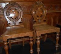 Lot 1107 - A pair of mid Victorian oak shaped back...