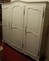 Lot 1118 - A French grey painted three door armoire...