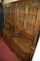 Lot 1122 - A contemporary moulded oak twin section lead...