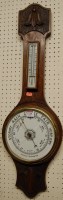 Lot 1128 - A mid 20th century oak two dial aneroid wheel...