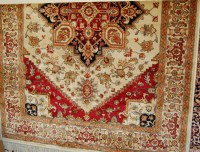 Lot 1155 - A Heriz woollen rug 190 x 140cm
