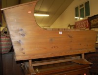 Lot 1186 - A modern pine baby's rocking crib