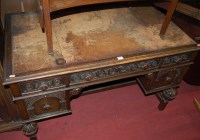 Lot 1189 - An early 20th century carved and moulded oak...