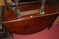 Lot 1192 - A 19th century mahogany dropleaf dining table,...