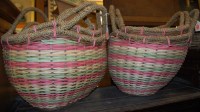 Lot 1199 - Two sets of three graduated wicker twin...
