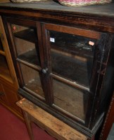 Lot 1200 - An early 20th century oak double door glazed...