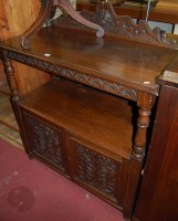 Lot 1214 - A circa 1900 carved oak ledgeback buffet...