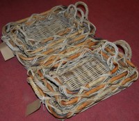 Lot 1215 - Two sets of three graduated wicker shallow...