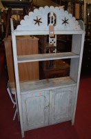 Lot 1216 - A rustic French painted pine bookshelf having...