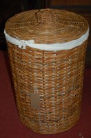 Lot 1232 - A wicker circular laundry box and cover