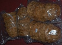 Lot 1241 - Four sets of four small wicker circular baskets