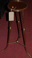 Lot 1248 - A circa 1900 turned brass and walnut circular...