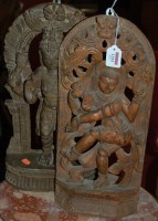 Lot 1251 - Two contemporary Eastern carved teak standing...