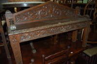 Lot 1252 - A late 19th century heavily carved oak two...