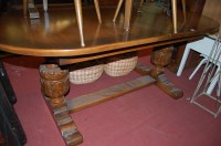 Lot 1258 - A contemporary moulded oak extending dining...
