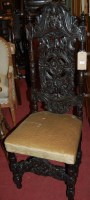 Lot 1378 - A pair of Caroleon style carved and ebonised...