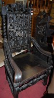 Lot 1385 - A late 19th century heavily carved oak...
