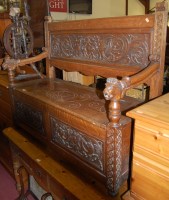 Lot 1429 - A circa 1900 heavily carved oak two panelled...