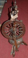 Lot 1432 - A rustic fruitwood spinning wheel