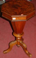 Lot 1433 - A figured walnut octagonal hinge top sewing table