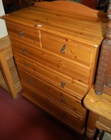 Lot 1434 - A modern pine round cornered ledgeback chest...