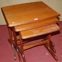 Lot 1439 - A 1960s G-Plan teak nest of three occasional...