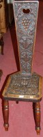 Lot 1440 - A circa 1900 low relief carved oak spinning seat