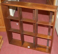 Lot 1442 - A hardwood square wall shelf, width 71cm