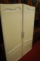 Lot 1453 - A French cream and white painted double door...