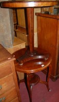 Lot 1460 - An Edwardian walnut circular two tier...