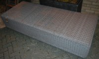 Lot 1137 - A large contemporary rattan stool, width 200cm