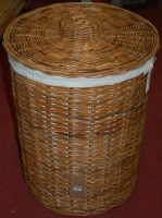 Lot 1221 - A large circular wicker laundry basket and cover