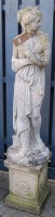 Lot 1322 - A reconstituted stone garden statue of a robed...