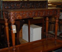 Lot 1391 - A Victorian heavily carved oak ledgeback hall...