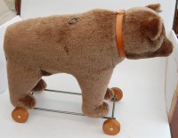 Lot 1503 - A Steiff teddy-bear on wheels, with growler,...