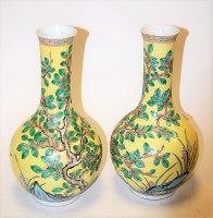 Lot 8 - A pair of Chinese bottle vases, each on a...
