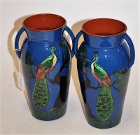 Lot 17 - A pair of Torquay Pottery twin handled vases,...