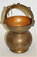 Lot 104 - An Indian brass holy water carrier having all...