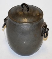Lot 105 - An early 20th century hammered pewter biscuit...